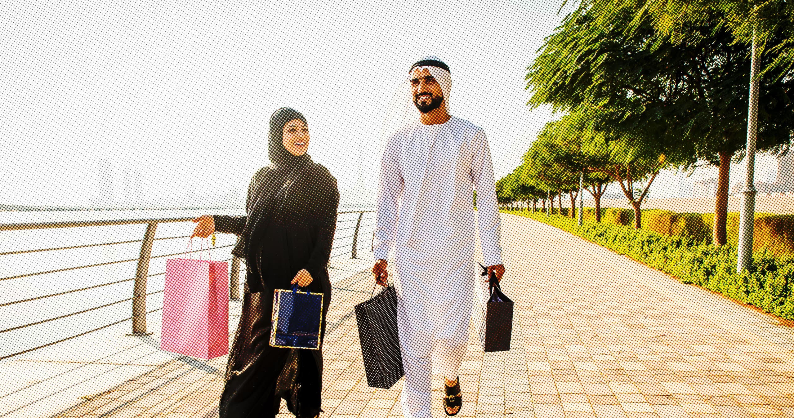 man and woman holding shopping bags in Dubai