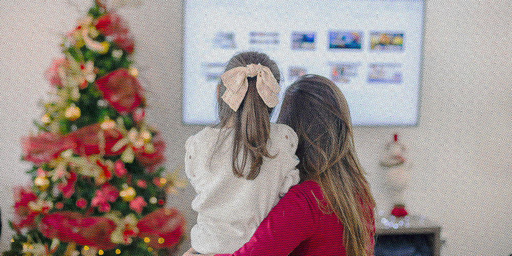 mother and daughter watching christmas tv