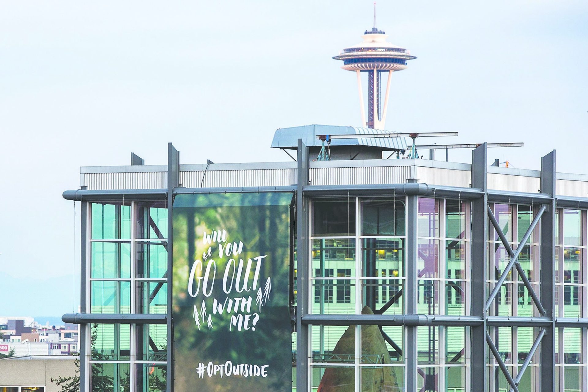 Building with an ad for the campaign #OptOutside displayed on it.